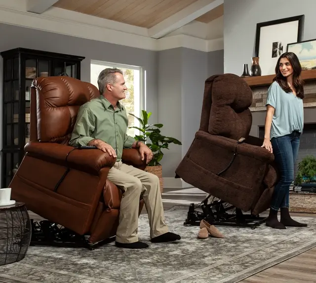 Two power lift chairs in a living room, one in use and one raised to help a woman stand