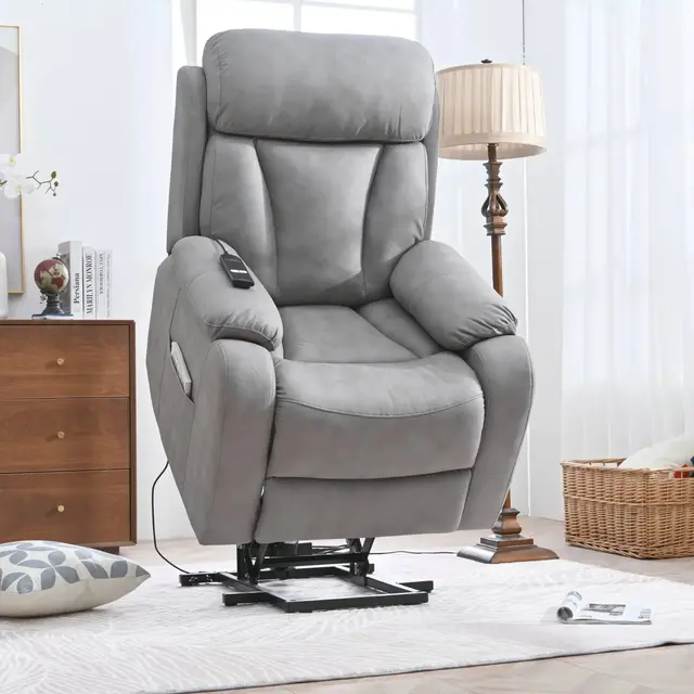 Grey power lift recliner in the raised position with its handheld remote